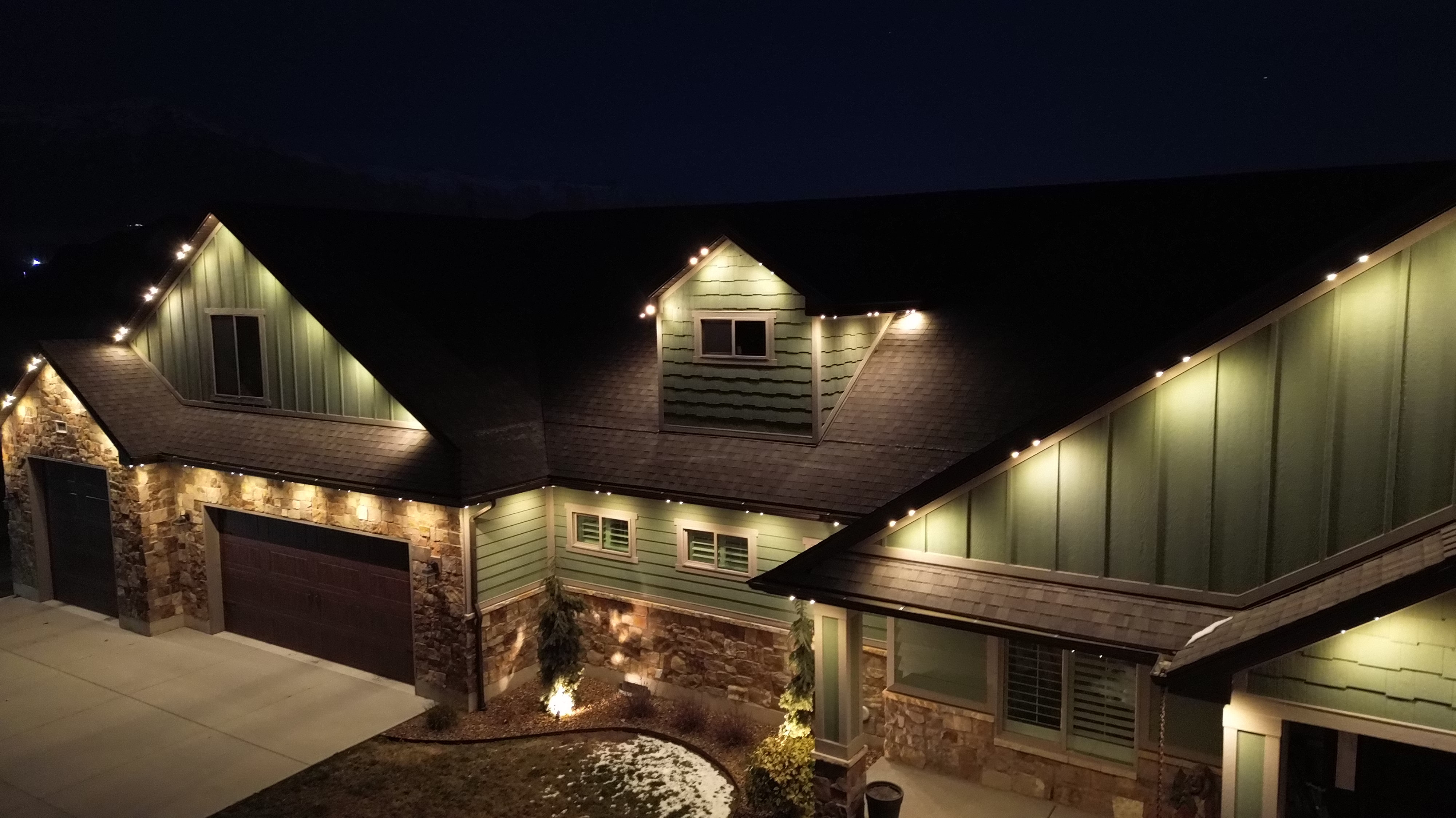 Warm white TruLight accents highlighting roof peaks