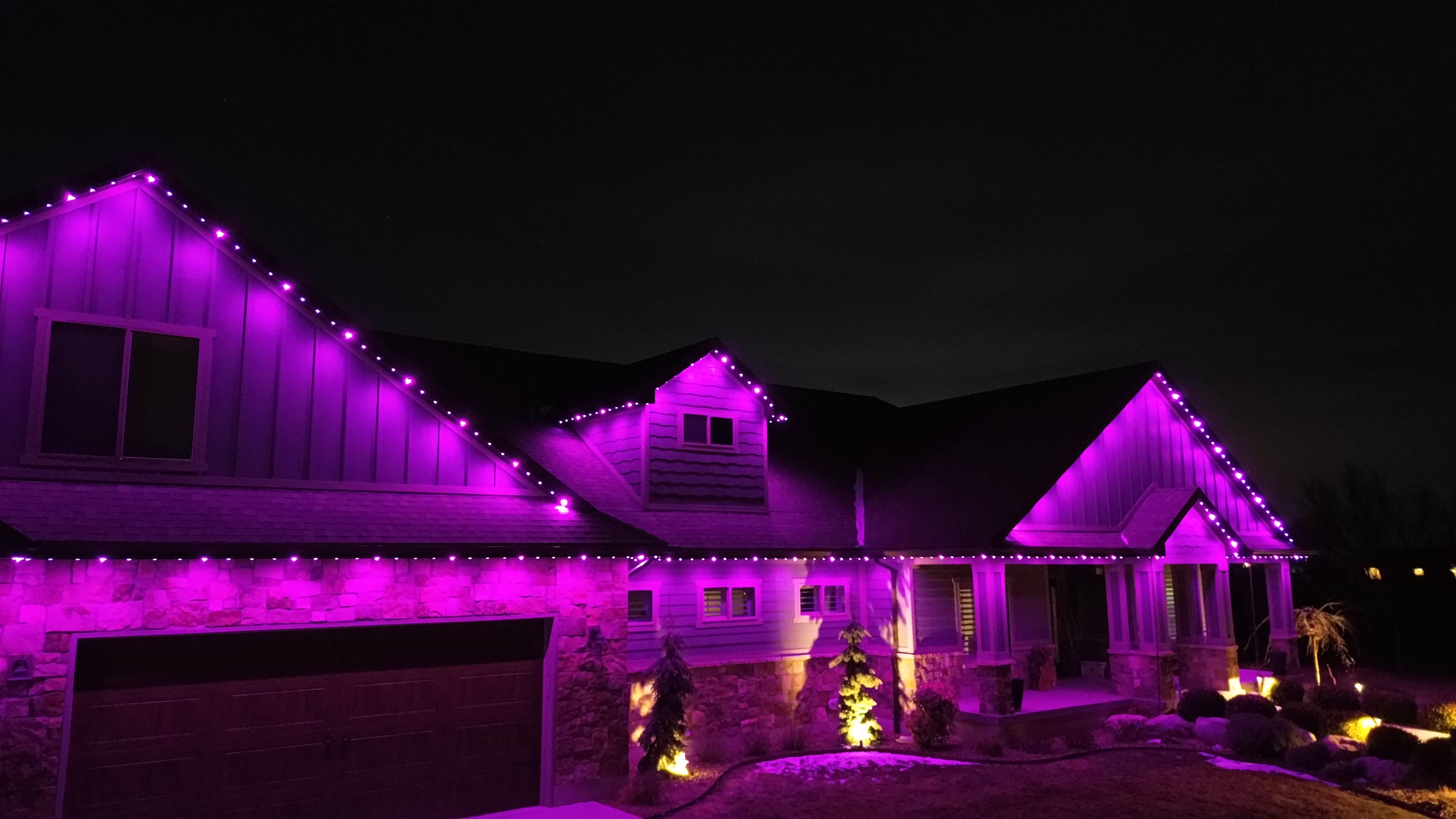 Home illuminated in bold purple TruLight lighting